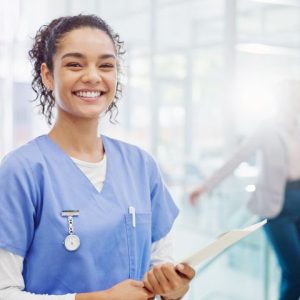 Medical Assistant holding clipboard