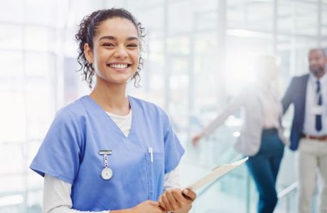 Medical Assistant holding clipboard