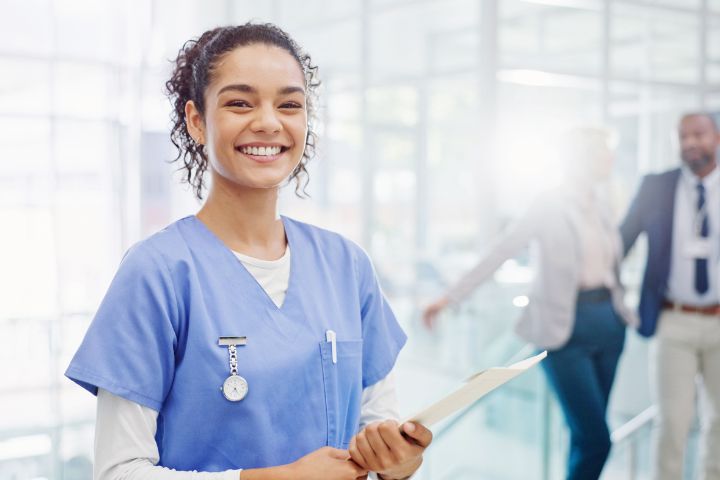 Medical Assistant holding clipboard