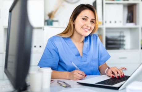 a medical assistant in her desk
