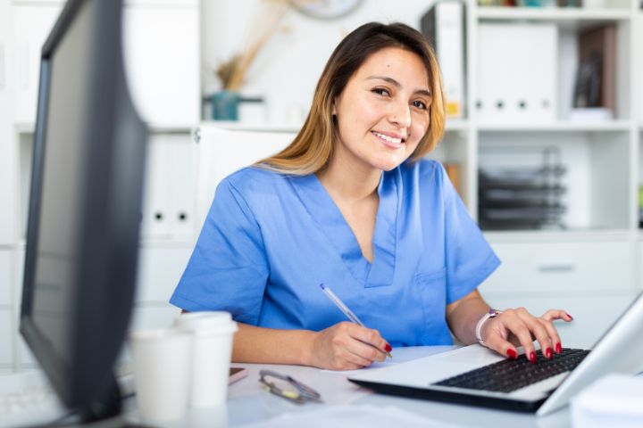a medical assistant in her desk