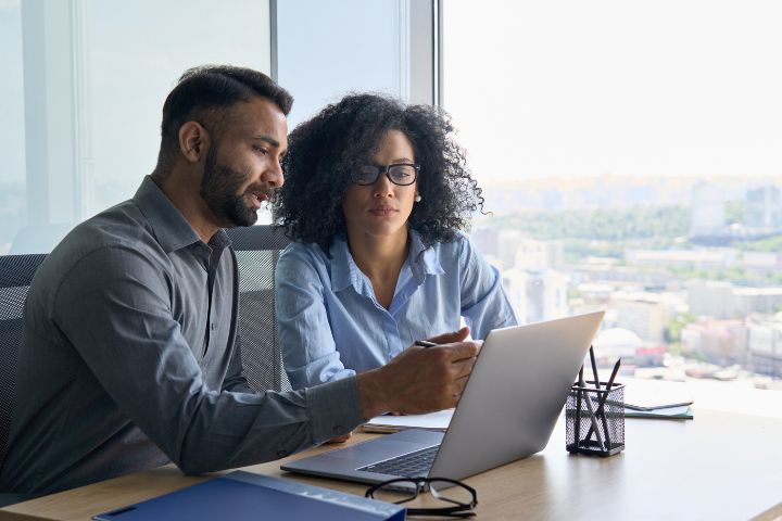 Business managers sitting at a desk