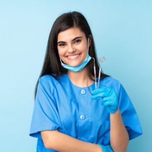 Dental Assistant holding tools
