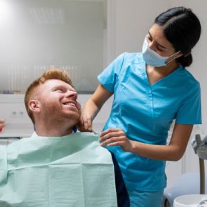 dental assistant with patient