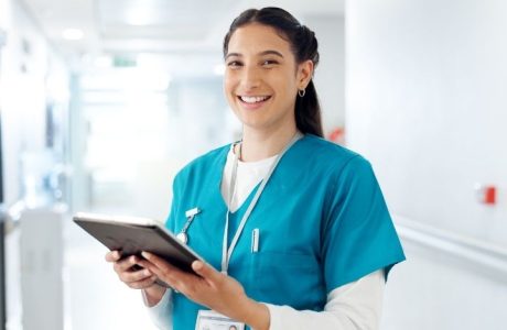 Medical assistant holding a clipboard