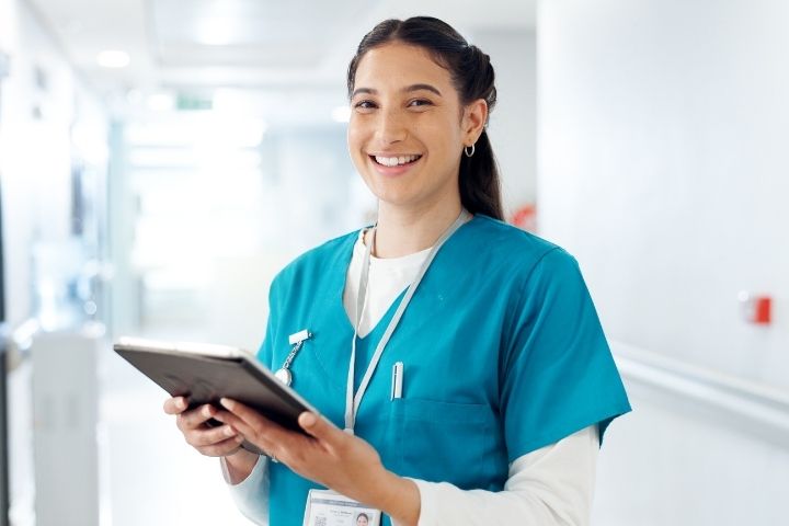 Medical assistant holding a clipboard
